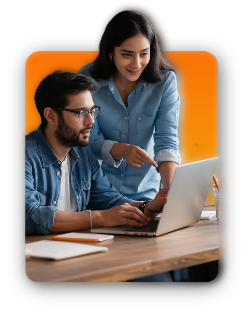 Two colleagues looking at a laptop